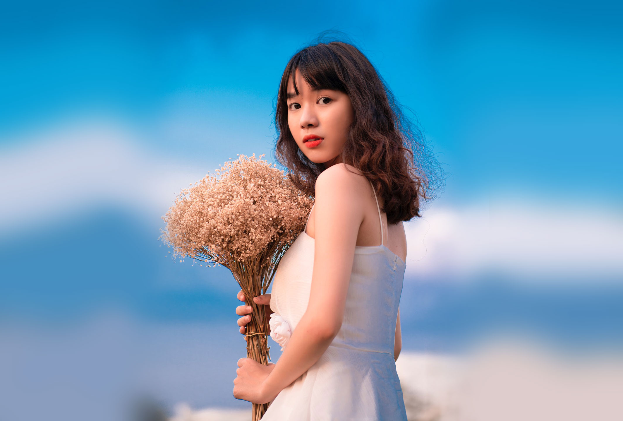 Japanese woman holding flowers